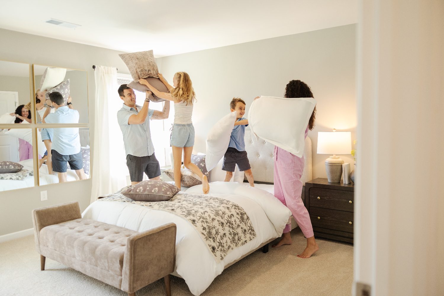 Family pillow fight at home