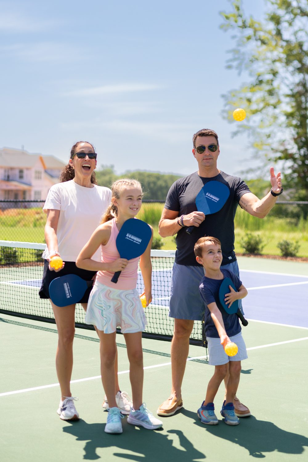 Family playing pickleball
