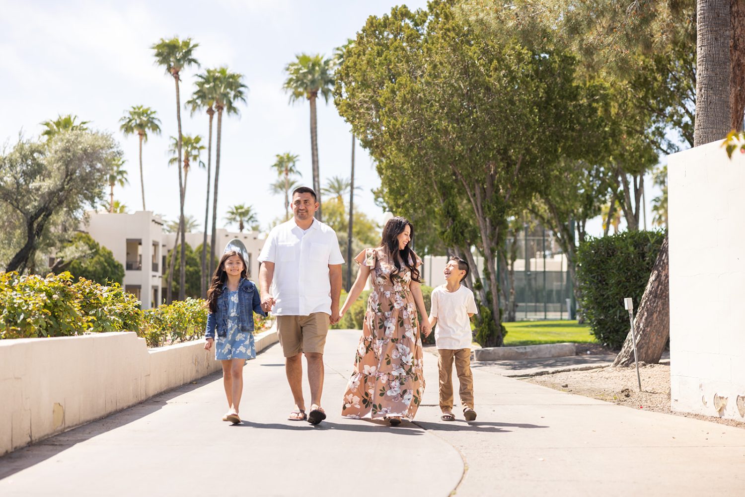 Family walking a neighborhood path
