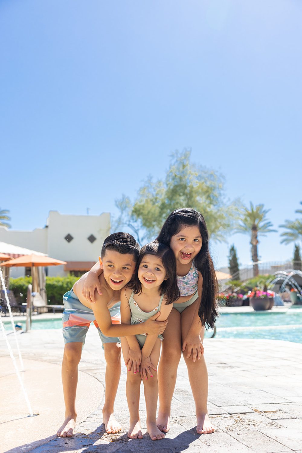 Kids playing poolside